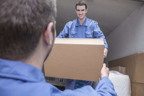 Man with a van loading furniture in a Mayfair street
