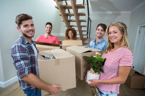 Moving team handling a home relocation in a Mayfair townhouse street
