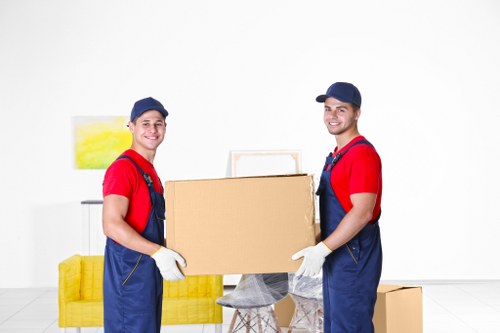 Removal van and moving team in a Mayfair street setting