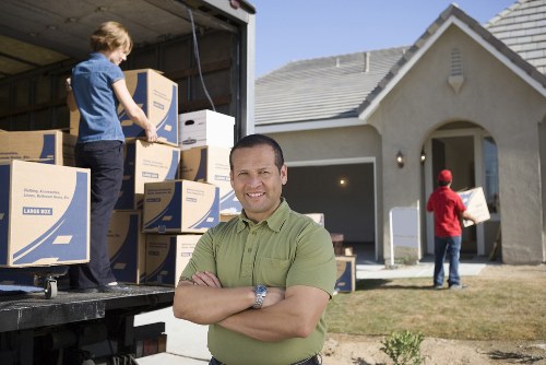 Professional movers loading a van for a Mayfair home or office relocation