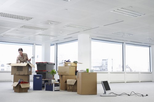 Professional movers carrying furniture in central London